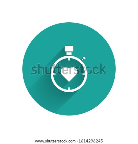 White Heart in the center stopwatch icon isolated with long shadow. Valentines day. Green circle button. Vector Illustration