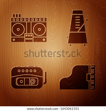 Set Grand piano, DJ remote for playing and mixing music, Music tape player and Metronome with pendulum in motion on wooden background. Vector