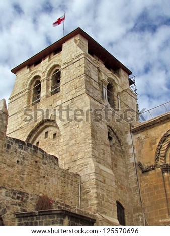 Bell Tower with flag of Church of the Holy Sepulcher in Jerusalem, Israel
