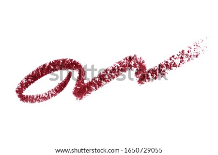 lip liner stroke smear smudge isolated on white. Trace makeup pencil burgundi color. Lip pencil stroke curly shape. Make up product texture. Woman cosmetic crayon. Macro, from above. Stock fotó © 