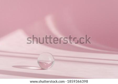 Pink background for product presentation with shadows and light from windows. Pink backdrop with transparent sphere decor, display, mockup. Window natural shadow overlay effect on pink surface