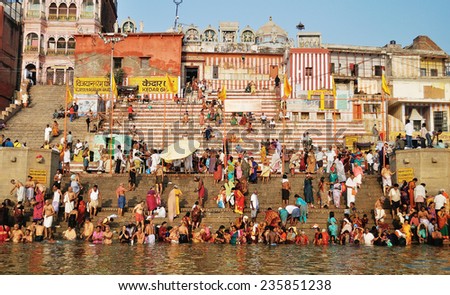 VARANASI, INDIA.- OCTOBER 23, 2014:Unidentified people taking holy bath in the river Ganga on the Diwali festival on October 23, 2014 in the holy city of Varanasi, Uttar Pradesh, India.