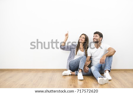 Similar – Image, Stock Photo Young couple resting on cozy sofa at home