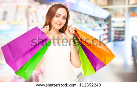 Picture of a beautiful woman with colorful shopping bags