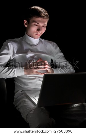 Young man in white with white laptop