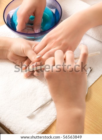 Woman\'s hands with nail file