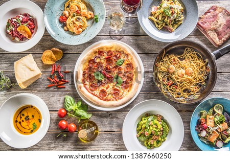 Similar – Image, Stock Photo Fresh cooked food in baking dish with various ingredients. Kitchen equipment. Dark concrete background.Flat lay. Top view