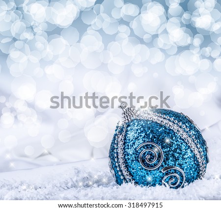 Christmas.Christmas blue balls and silver ribbon snow and space abstract background.