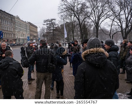 RIGA, LATVIA - JANUARY 15: Latvian people demand decrease price for public transport on the Central square on January 15, 2015 in Riga, Latvia