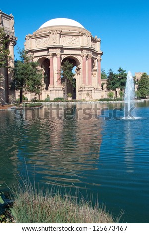 Exploratorium and Palace of Fine Arts in San Francisco with beautiful blue sky in background.