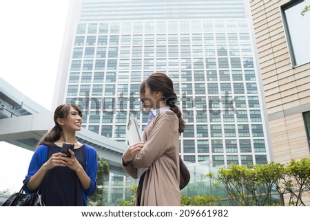 Women conversation with a smart phone