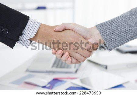 Handshake business man and business woman