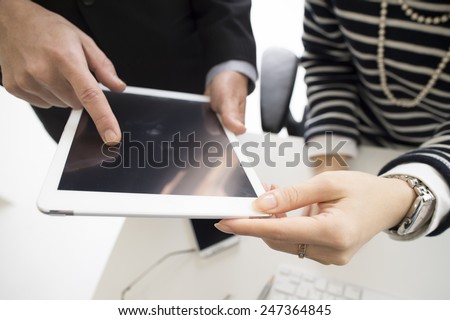 Businessman pointing a digital tablet