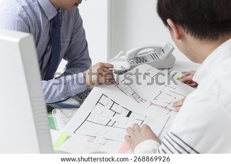 View of a young relaxed couple meeting a real estate agent