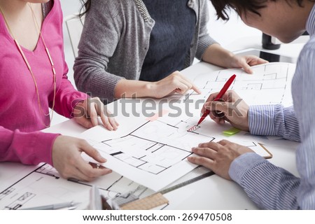 Woman discussing with consultant, real estate agent or architect