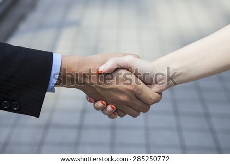 People to shake hands in the office district