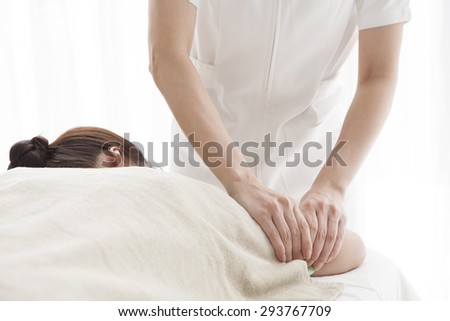 Woman getting a massage at a health and beauty spa