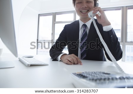 Man speak with the other party and the smile of the phone