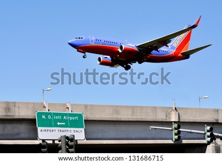 NEW ORLEANS, LA-MARCH 15:  Southwest jet on final approach to New Orleans International Airport on March 15, 2013.  Southwest began non-stop service between New Orleans and Key West on March 9, 2013.