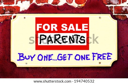 A Beige Placard Sign On Maroon Stucco And Brick Background With A Sign Saying \