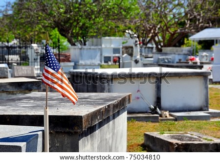 Small American Flag Flying Over Cemetery With Selective Focus On Flag