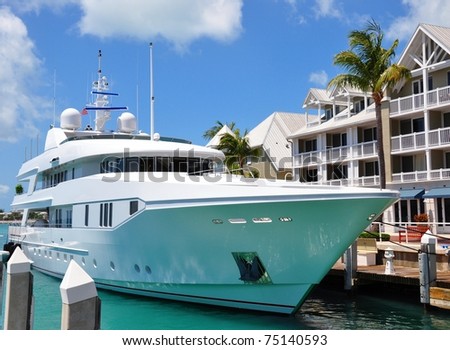 Luxury Yacht Docked In Front Of Waterfront Condominiums