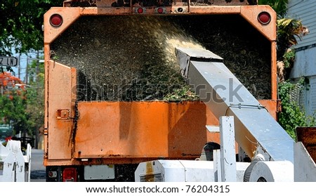 Wood Chipper Machine Filling Back Of Truck With Mulch