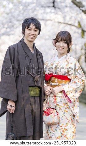 KYOTO, JAPAN - APRIL 12, 2014 : Japanese couple dressed in traditional suite (Yukata), the form of Japanese traditional clothing during visit Shinto temple.