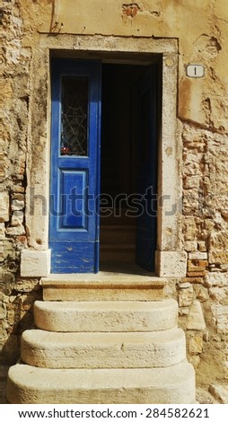 Blue door with stairs