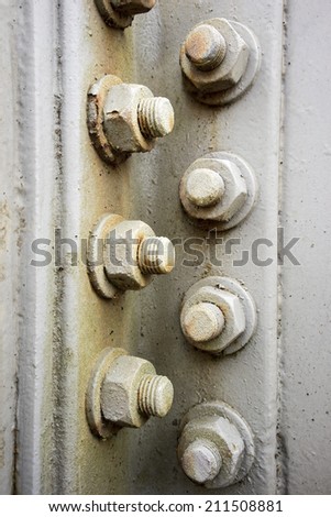 Metal plates at a construction held together by screws and nuts/Metal Construction Detail