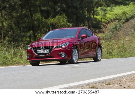 Ha Noi, Viet Nam - April 13, 2015: Mazda3 all new (2015) car running on the moutain road in Vietnam