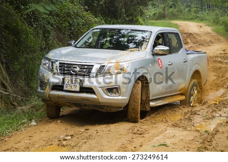 Tuyen Quang, Viet Nam - April 23, 2015: Nissan NP300 Navara car running on the mud road in Vietnam