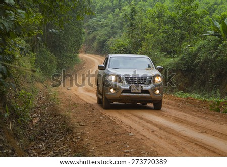 Tuyen Quang, Viet Nam - April 23, 2015: Nissan NP Navara running on the dirt road in Vietnam
