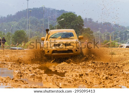 Hanoi, Vietnam - July 4, 2015: Mitsubishi Triton pick-up car doing an circuit of Vietnam Off-road Cup (VOC) in a water road area of Hanoi