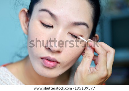 Asia woman is intended for makeup her face