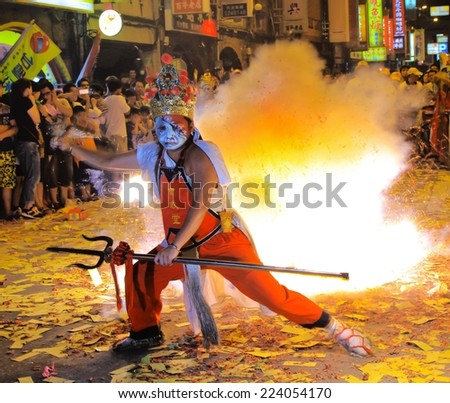Hsinchu, Taiwan -2014-aug 10: The Messenger of God, face painting in Hsinchu, Taiwan to stop the fierce ghost firecrackers in Ghost Festival August 10