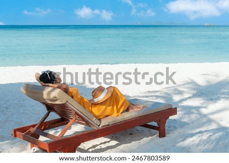 Similar – Image, Stock Photo Woman resting on sandy beach on cloudy day