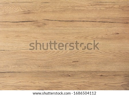 Wood texture background. Top view of vintage wooden table with cracks. Light brown surface of old knotted wood with natural color