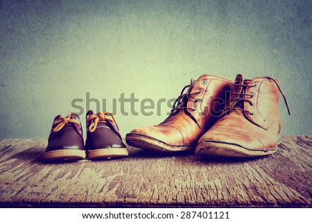 Daddy\'s boots and baby\'s shoes
