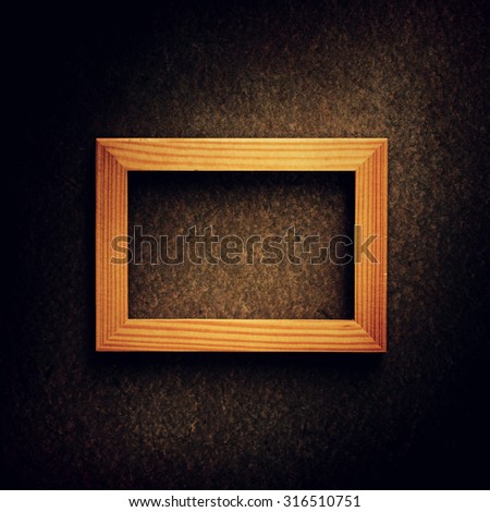 Wooden vintage photo frame over grunge background, Still life style