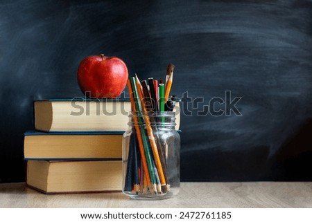 Similar – Image, Stock Photo Back to school background with school supplies on blackboard. Pencils, pens, cardboard, colorful background