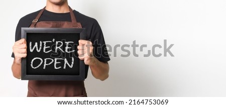 Similar – Image, Stock Photo Crop Asian waitress serving burger in cafe