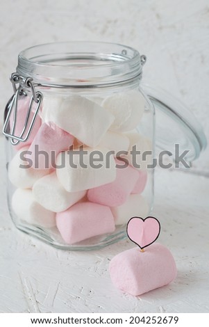 Marshmallows in a Glass Jar and a Paper Heart on a Stick
