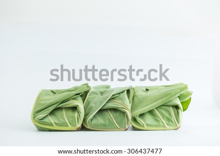 Water lilly leaf wrap for food inside on white background, Asia Thailand country packaging natural style