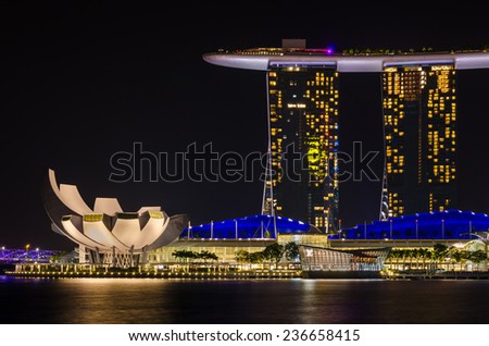 Singapore - August 20: Night view of the hotel Marina Bay Sands and Scientific museum of arts on August 20, 2014  in Singapore.