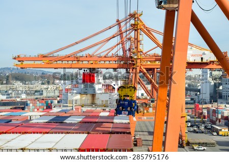 Vancouver, Canada - March 08: Cargo operations in port and industrial city in the Vancouver on March 08, 2015  in Vancouver, Canada.