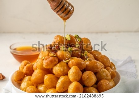 Image, Stock Photo Honey pouring over fried toasts with fruit