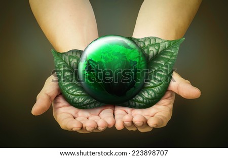 Green planet in  hands