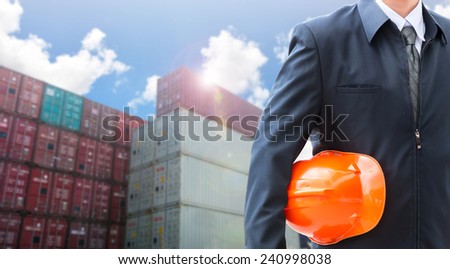 engineer orange helmet for workers security on the background of a  logistic port.