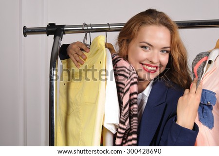 Woman in formal attire excited buying things in a clothing store